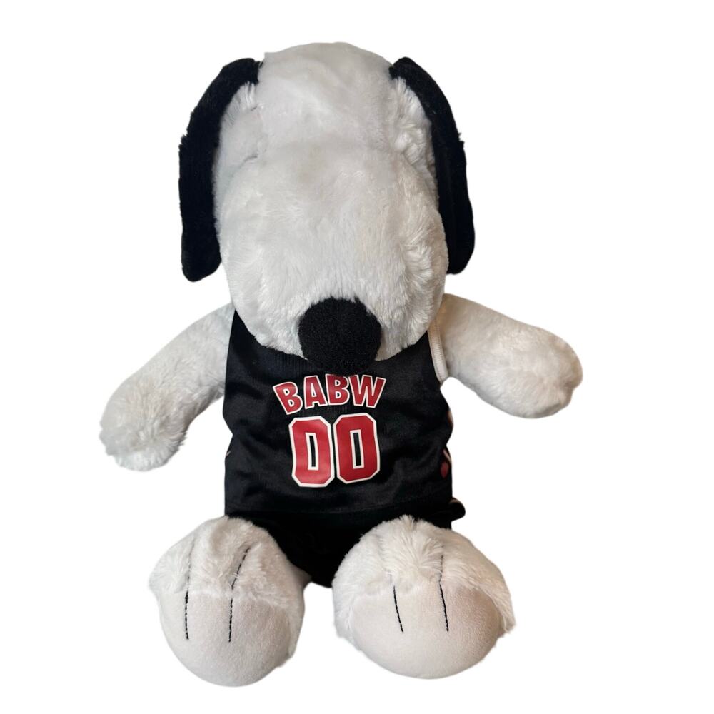 Build-A-Bear Workshop Snoopy plush toy wearing a black and red basketball jersey